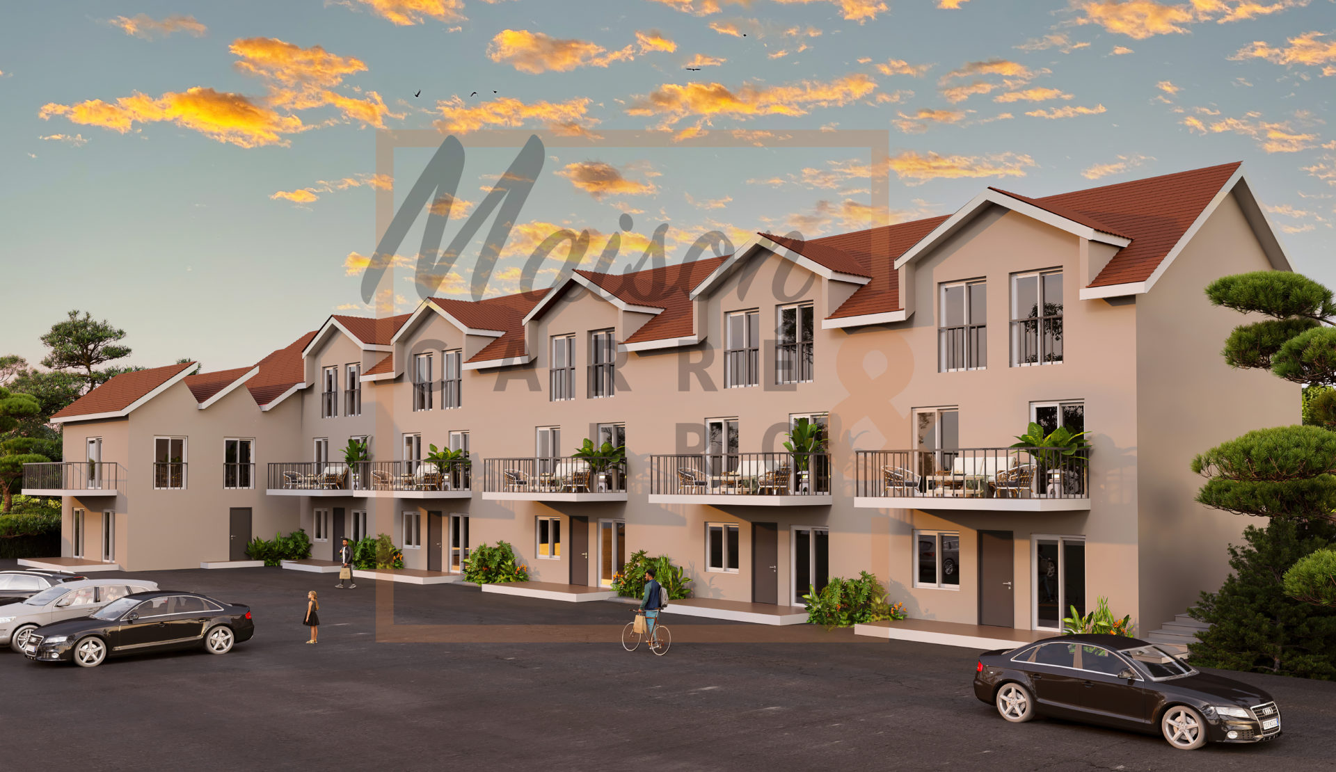 Résidences modernes au coucher de soleil avec voitures et cycliste.