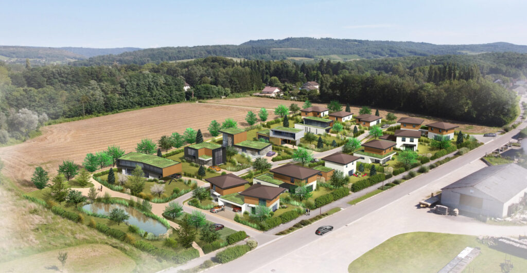 Vue aérienne d'un développement résidentiel moderne près d'un champ.